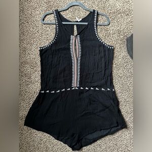 Sleeveless romper, black with pink and white detail, size large